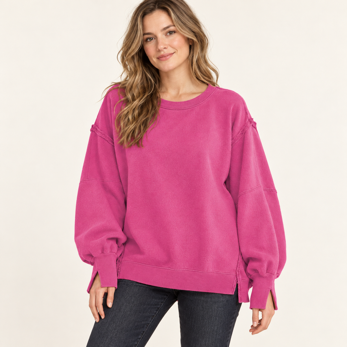 Hot Pink women's oversized split-hem sweatshirt, front view on a synthetic adult model