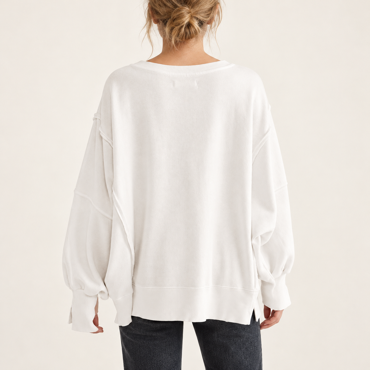 Off White women's oversized split-hem sweatshirt, back view on a synthetic adult model