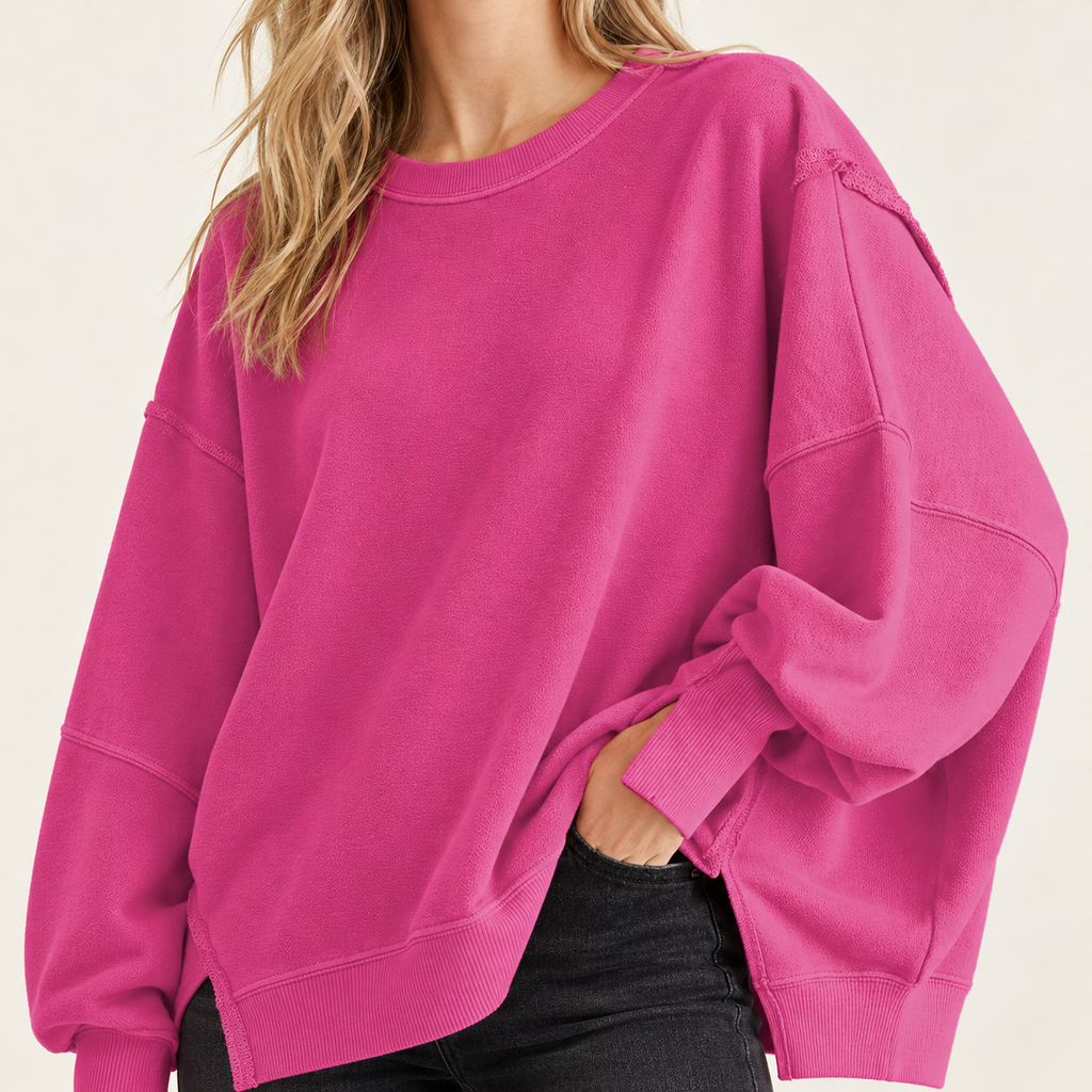 Hot Pink women's oversized split-hem sweatshirt, shoulder and neckline detail on a synthetic adult model