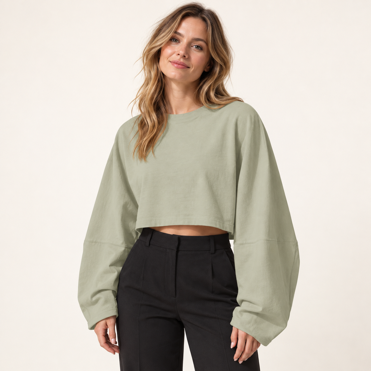 Sage Green women's wide-sleeve cropped sweatshirt, front view on a synthetic adult model