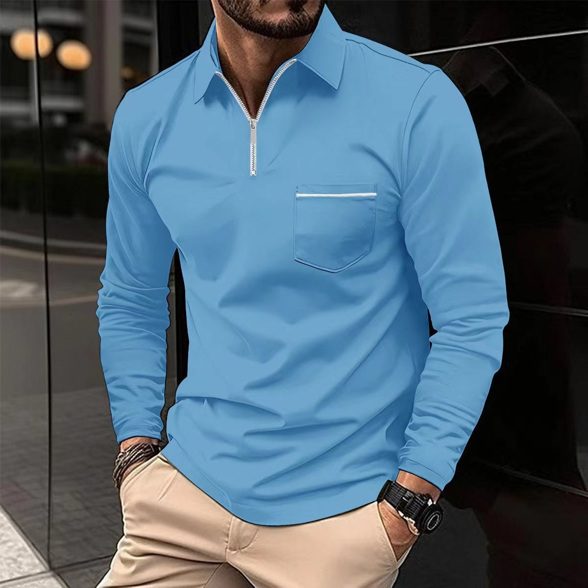 Sky blue long-sleeve quarter-zip polo on a male model, with a contrast-trim chest pocket