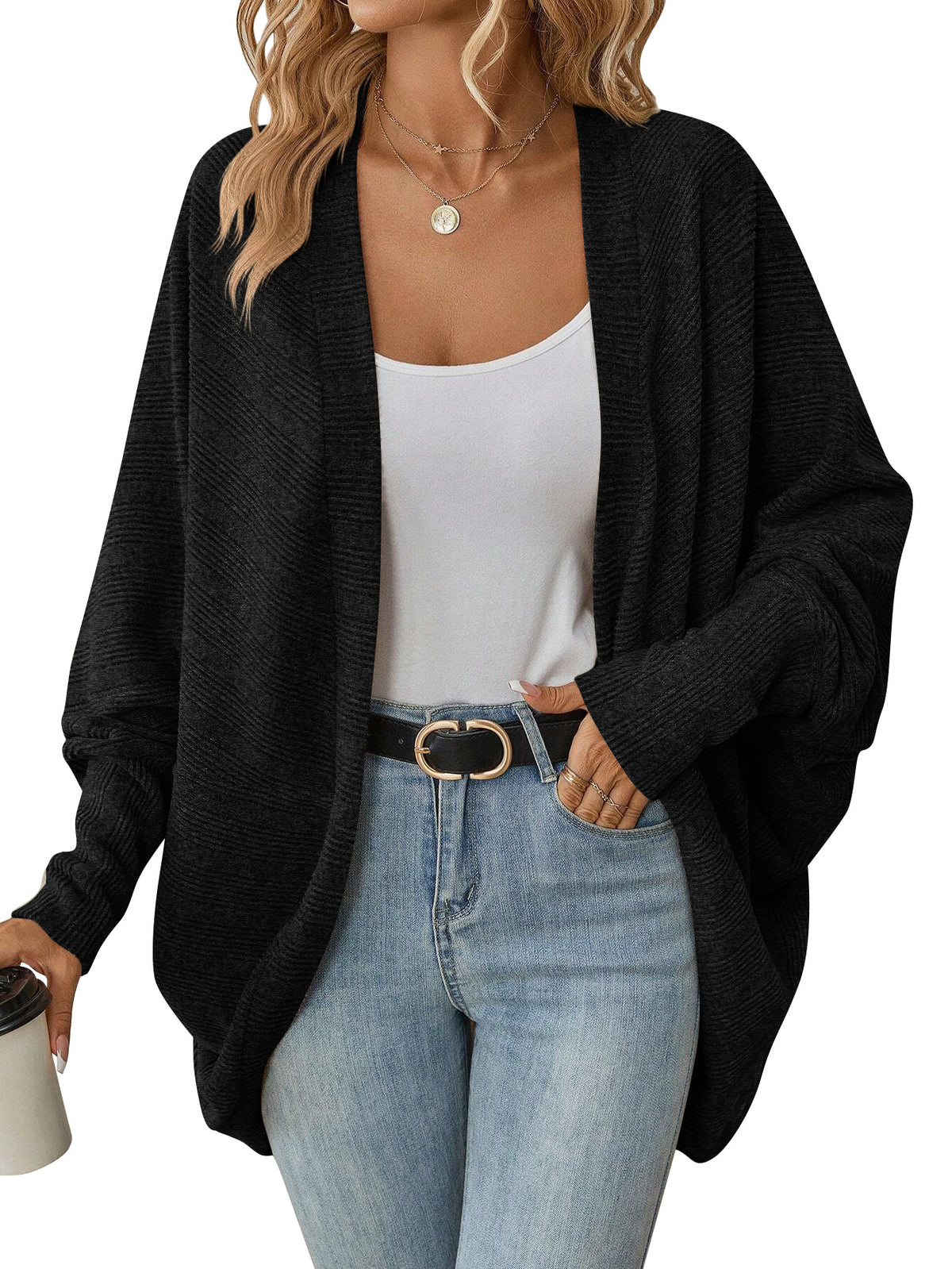 Black open-front batwing knit cardigan on a model, with ribbed cuffs and a draped hem