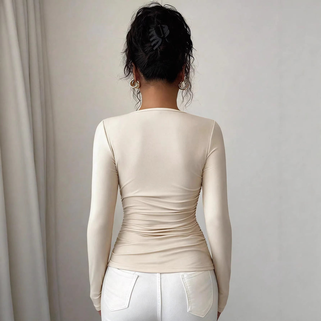 Beige asymmetric neckline ruched long-sleeve top, back view