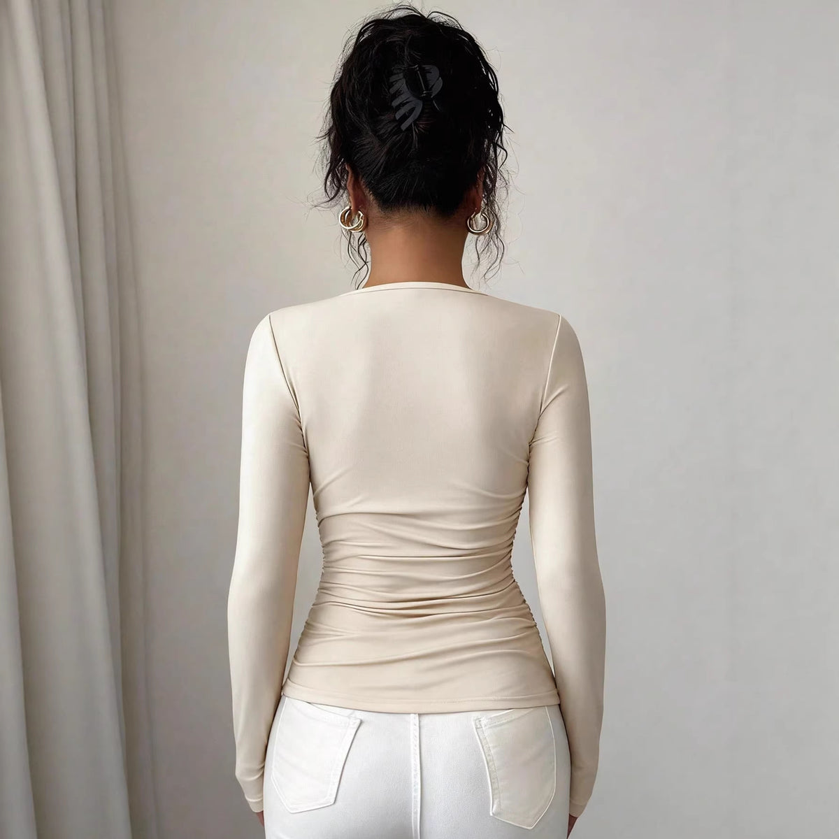 Beige asymmetric neckline ruched long-sleeve top, back view