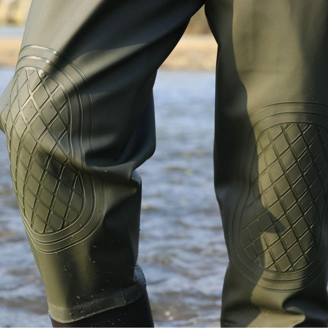 Green diamond-pattern knee-panel close-up.