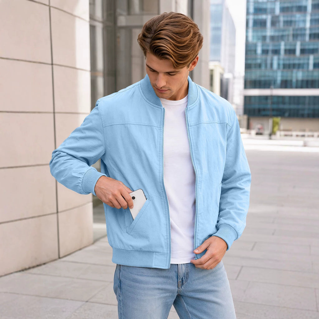 AZUKI men's light blue bomber jacket on an adult model outdoors