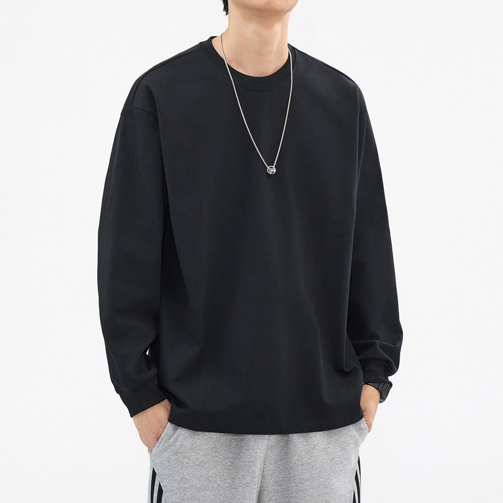 Black relaxed crewneck long-sleeve top, front view