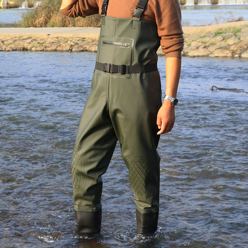 Green chest waders pocket and black waist-belt detail.