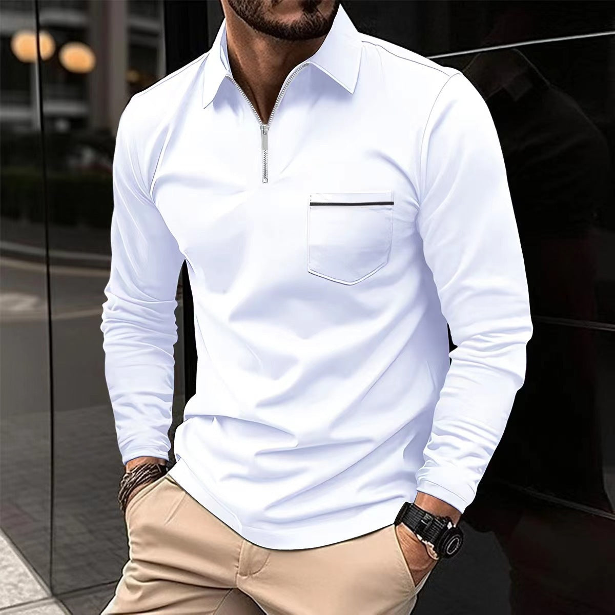 White long-sleeve quarter-zip polo on a male model, with a contrast-trim chest pocket