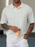 White geometric-textured short-sleeve polo on a male model, front view showing the collar and short placket