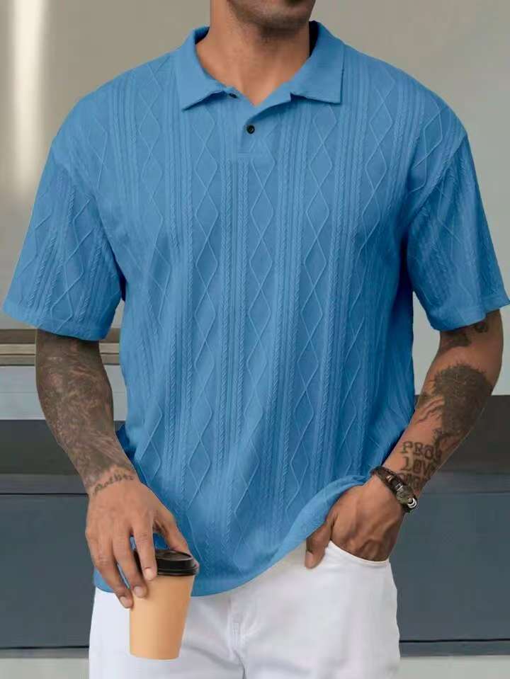 Blue geometric-textured short-sleeve polo on a male model, front view showing the collar and short placket