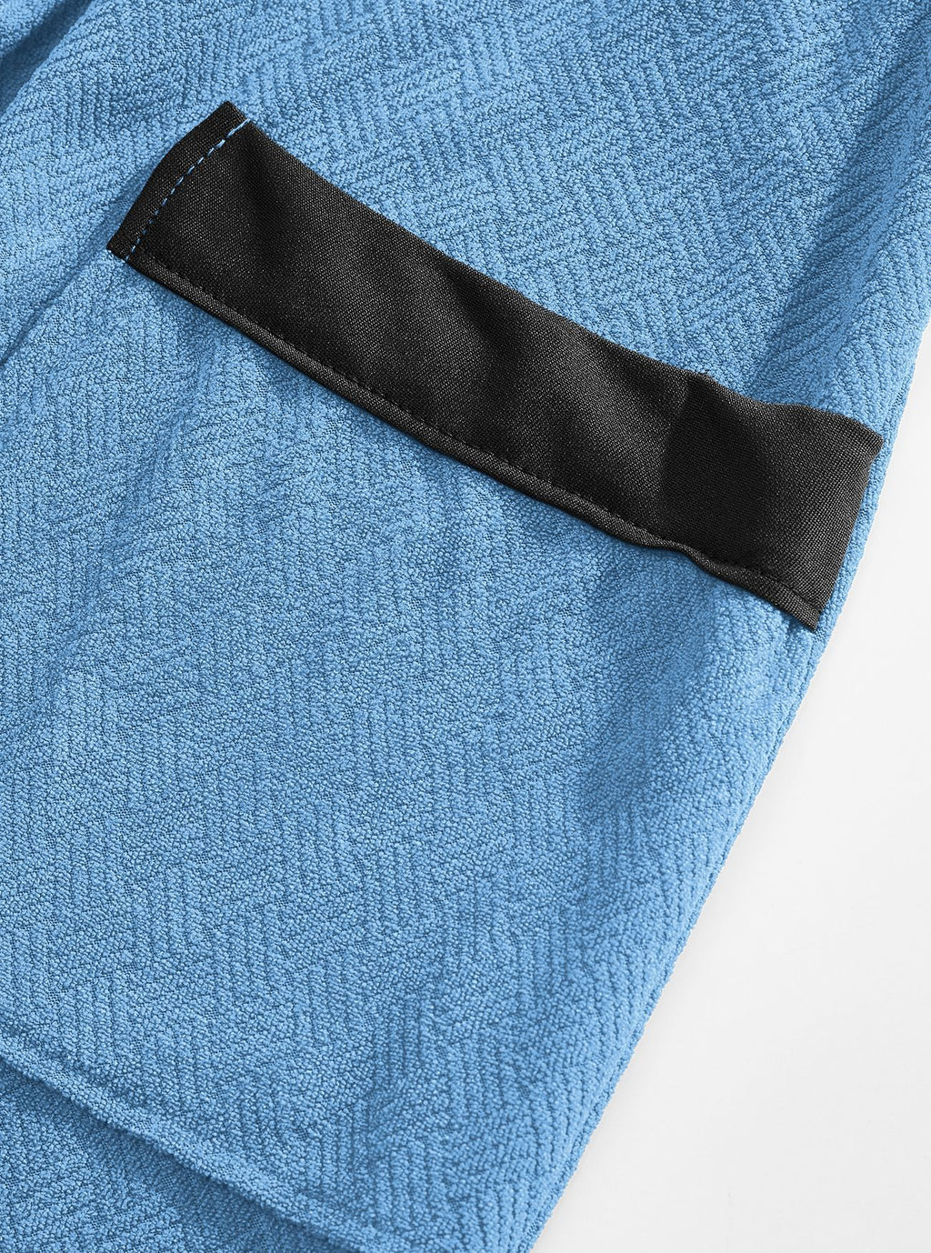 Blue terry patch pocket with black top edging and fine square texture