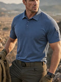 Denim blue short-sleeve polo on a male model, showing the button placket and upper-sleeve flap detail
