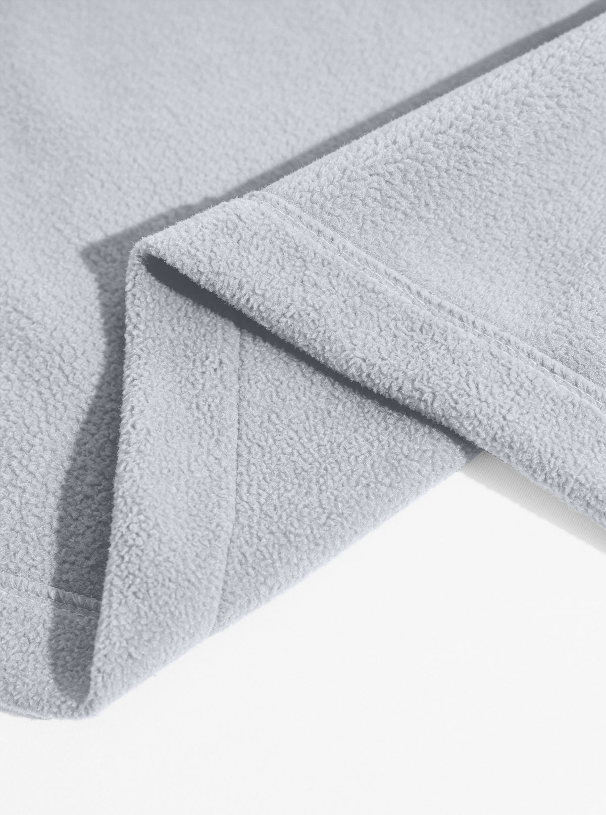 Light gray fleece jacket stitched hem detail