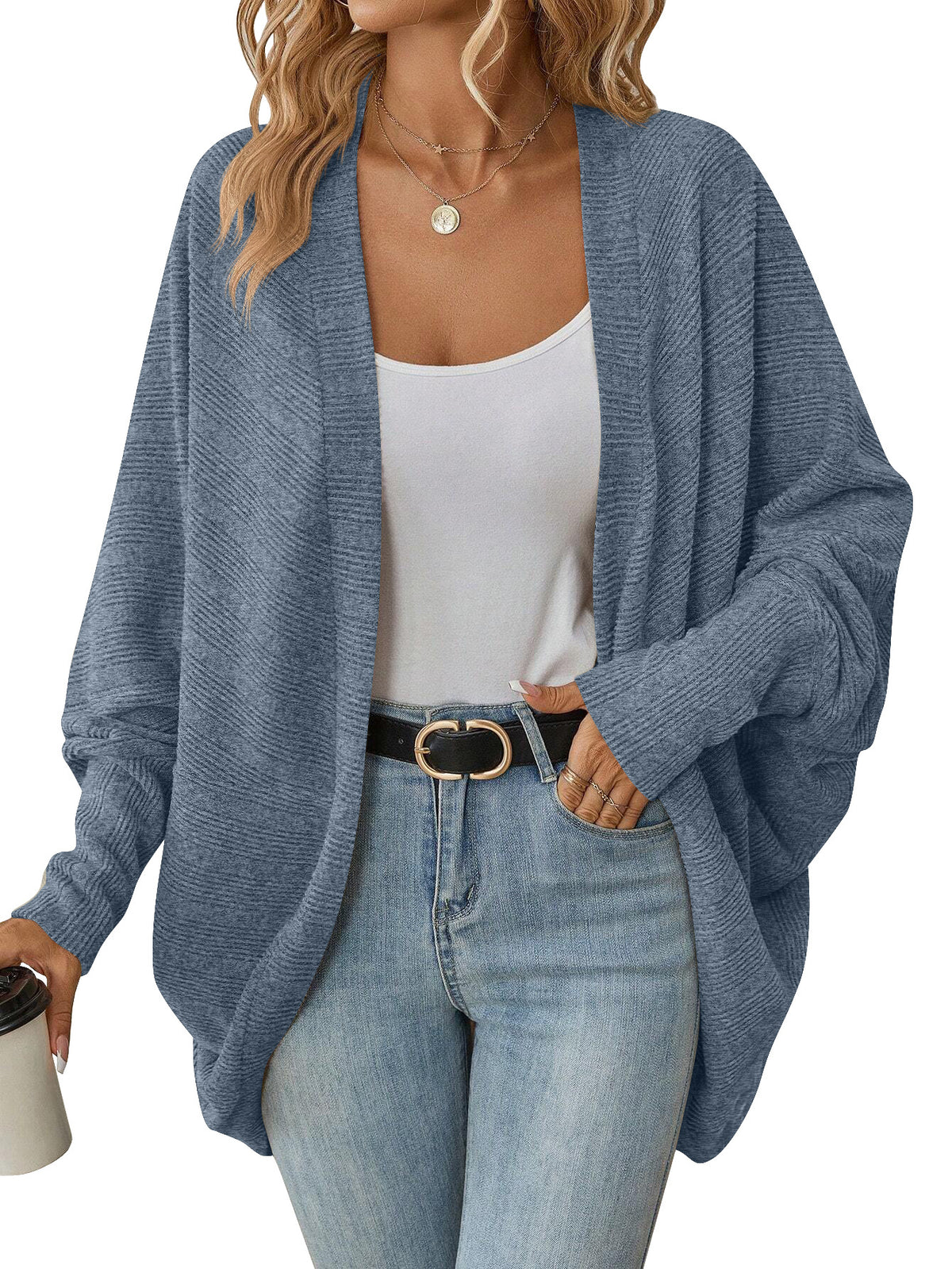 Blue open-front batwing knit cardigan on a model, with ribbed cuffs and a draped hem