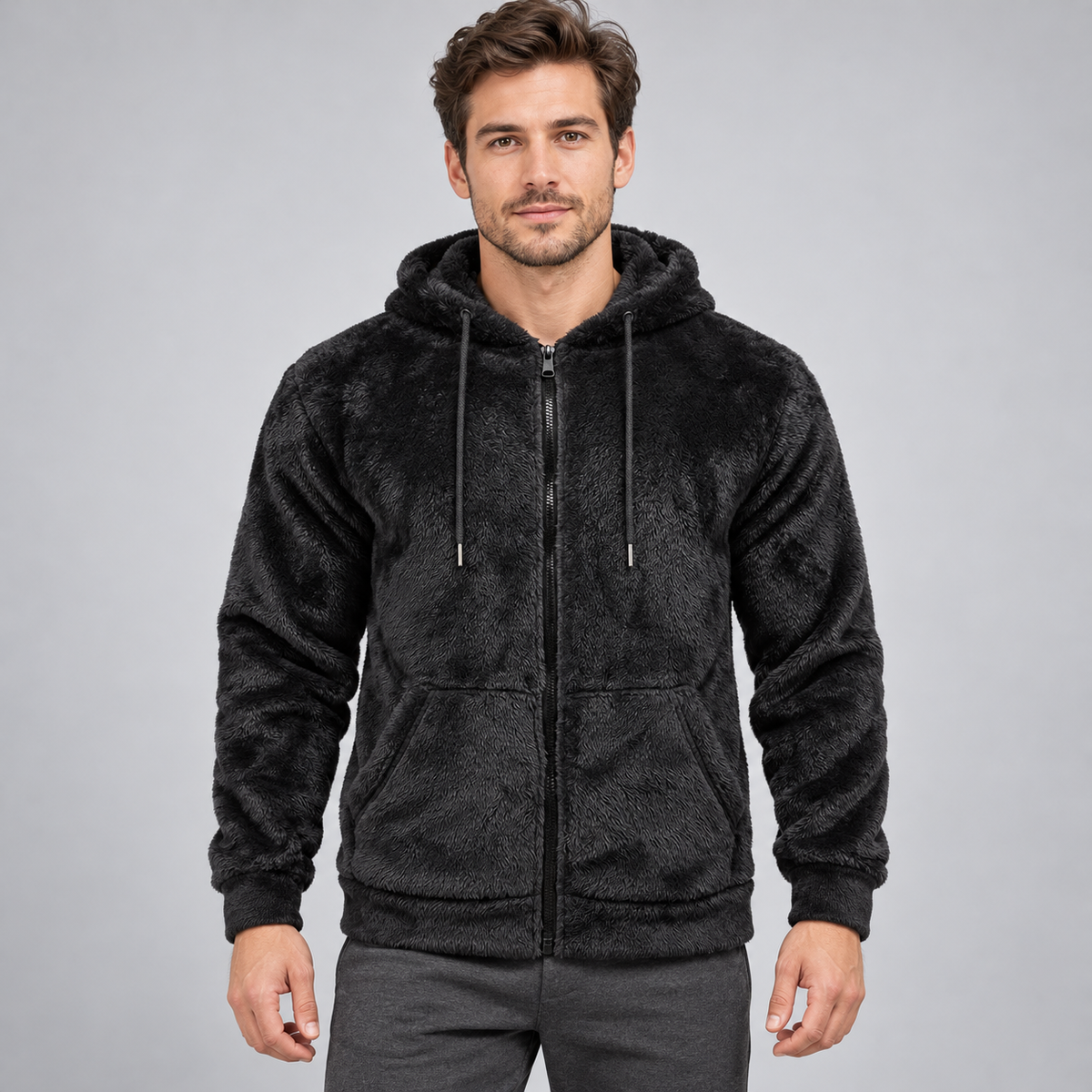 Black fleece zip-up hoodie worn by an adult male model; AI-styled image using the confirmed garment construction and fleece photo references.