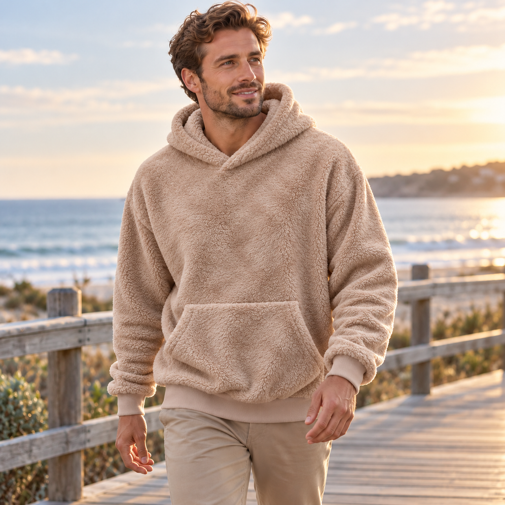 AZUKI khaki textured fleece pullover hoodie on an adult model at a coastal boardwalk; AI-styled visualization corrected against supplier garment and fine-pile detail photos.