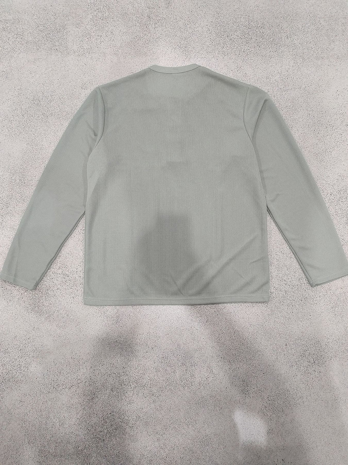 Light green Henley back flat-lay
