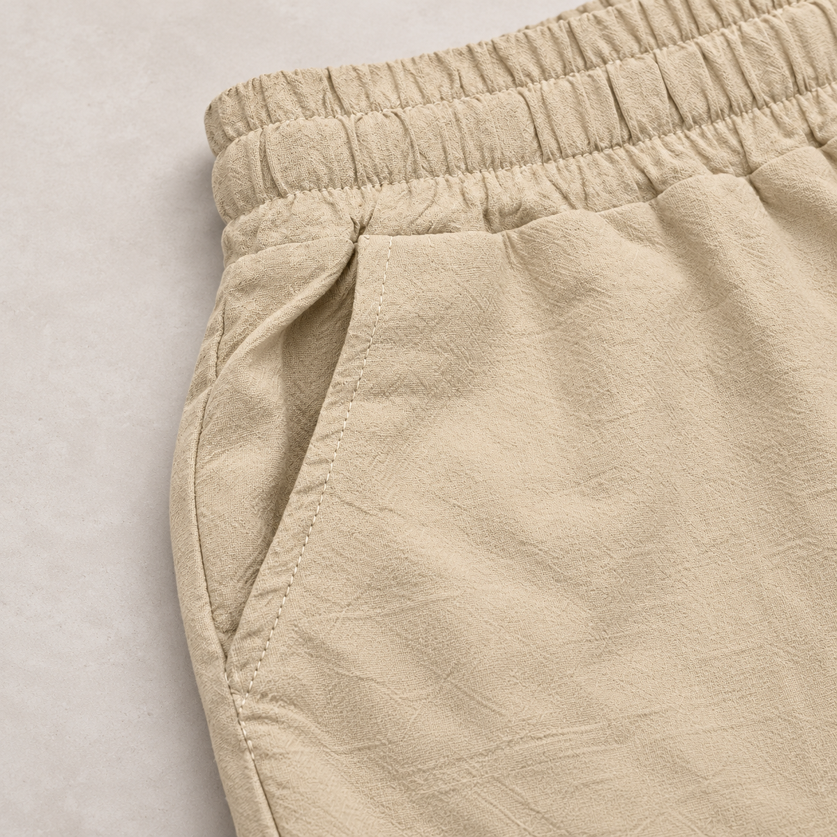 Khaki pants side-entry pocket detail