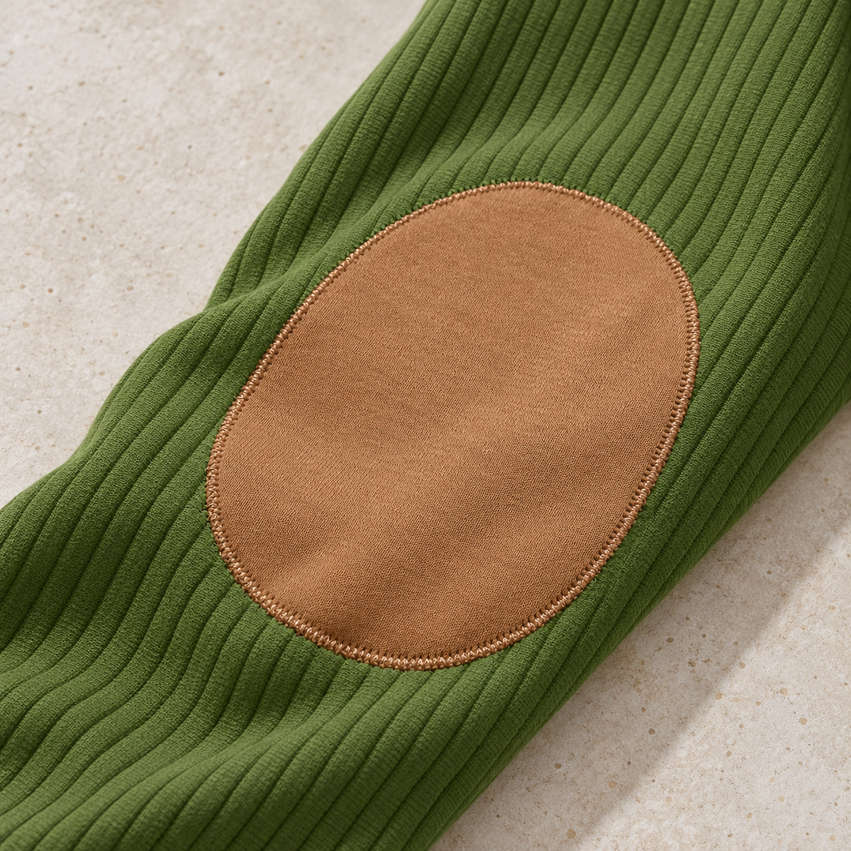AZUKI FX-YC73 olive green sleeve with a local oval tan knit elbow patch and edge stitching