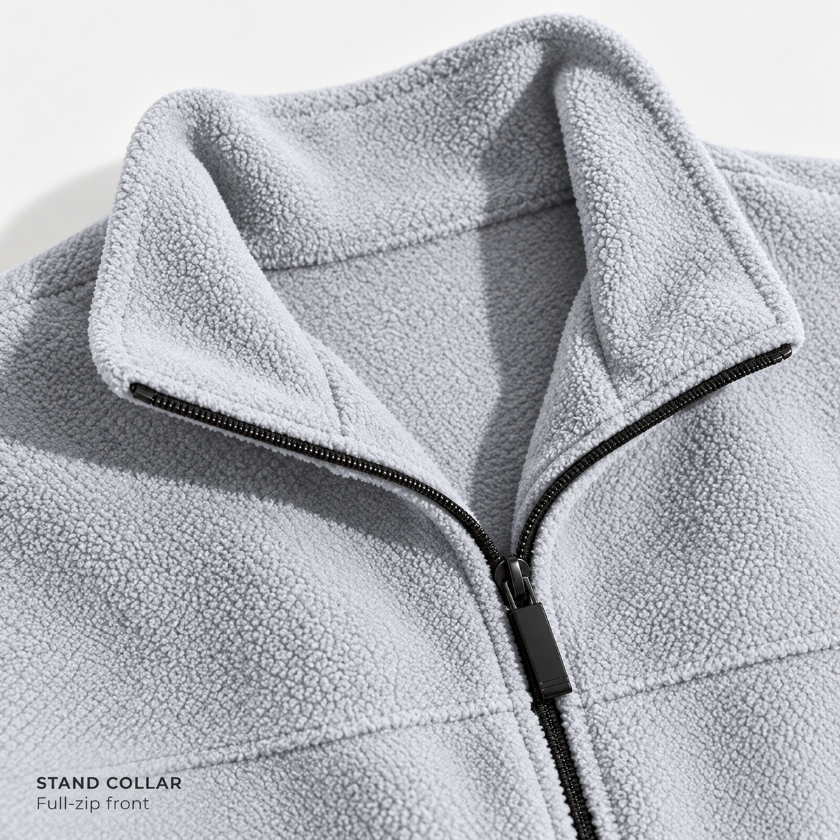 Light gray FX71 fleece stand collar and black full front zipper close-up