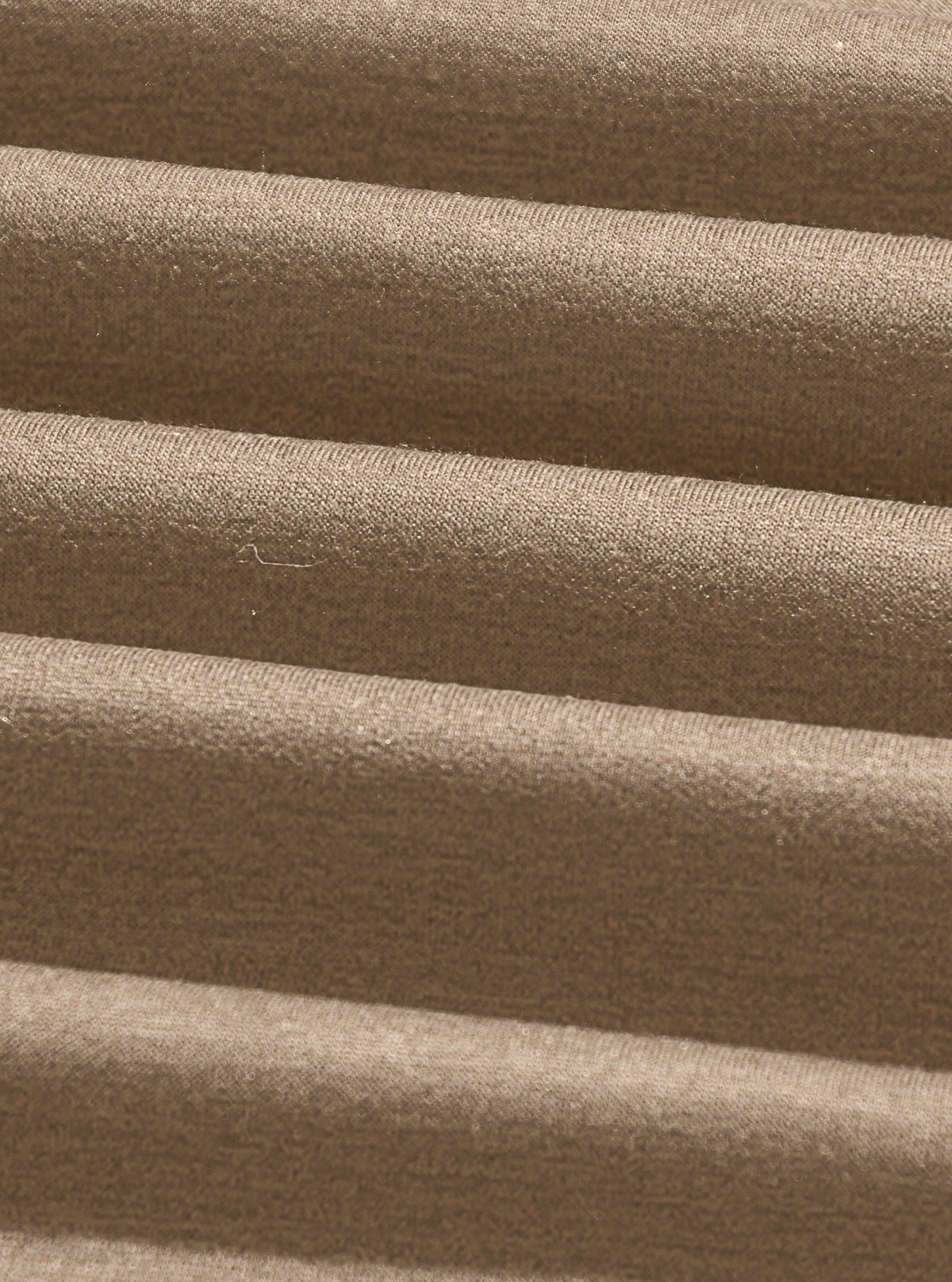 Close-up of the heather camel cotton-blend knit fabric
