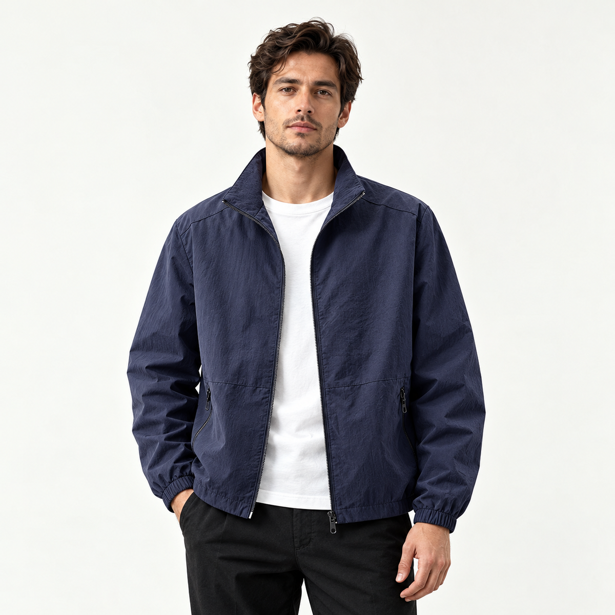 Adult model wearing the AZUKI navy blue stand-collar zip jacket, front view